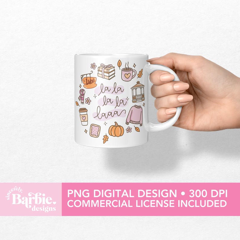 May include: White ceramic mug with a whimsical design featuring fall-themed illustrations and the phrase "la la laaa" in a handwritten style. The mug includes images of a pumpkin, sweater, coffee cup, and other autumn elements.