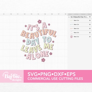 May include: A digital design file for a cutting machine. The design features a pink, blue, and yellow text graphic that says "It's a beautiful day to leave me alone." The design is surrounded by pink and yellow flowers.