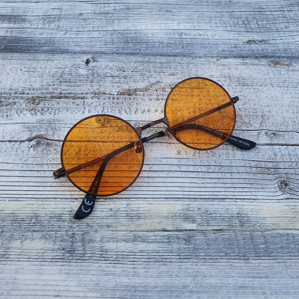 Small Light Orange Round Sunglasses. Black Frames. UV protected.