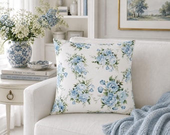 Cojín decorativo floral de rosas azules, de poliéster hilado.