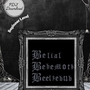 May include: A framed cross-stitch pattern with the words "Belial, Behemoth, Beelzebub" in gothic lettering. The frame is ornate and dark, set against a textured black background with spiderwebs and the text "PDF Download" and "Beginner Level".