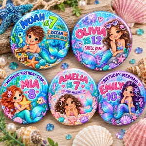 May include: Five circular badges featuring cartoon mermaids and mermen with names and ages. Designs include Noah is 7, Olivia is 12, Mia is 8, Amelia is 7, and Emily is 10, decorated with colourful underwater elements like shells, coral, and starfish.
