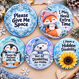 May include: Five circular badges with winter themes. One says Please Give Me Space with snowflakes. One shows a fox with a clock saying I May Need Extra Time. One shows a penguin saying Please Be Patient With Me. One shows a polar bear saying Not All Disabilities Are Visible. One shows a sunflower saying I Have a Hidden Disability.
