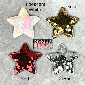 May include: Four star-shaped sequin patches in iridescent white, gold, red, and silver. Each star has a different color and is made of sequins. The patches are displayed on a gray surface. The text "Iridescent White", "Gold", "Red", and "Silver" are written below each star.