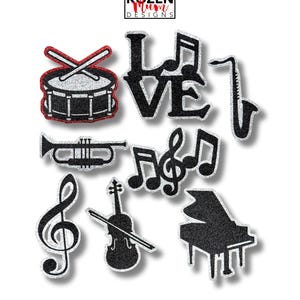 Music Glitter Paper Die Cuts for Homecoming Mums & Garters. Features: Drums, Stringed Instrument, Trumpet, Piano, French Horn, Music Notes.