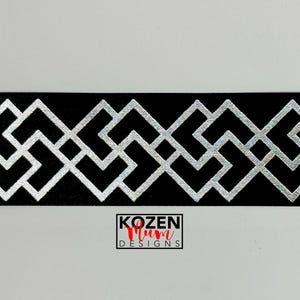May include: Black ribbon with a geometric silver pattern. The design features interlocking squares and angled lines. The ribbon has a repeating pattern and the text "KOZEN Mum DESIGNS" is visible.