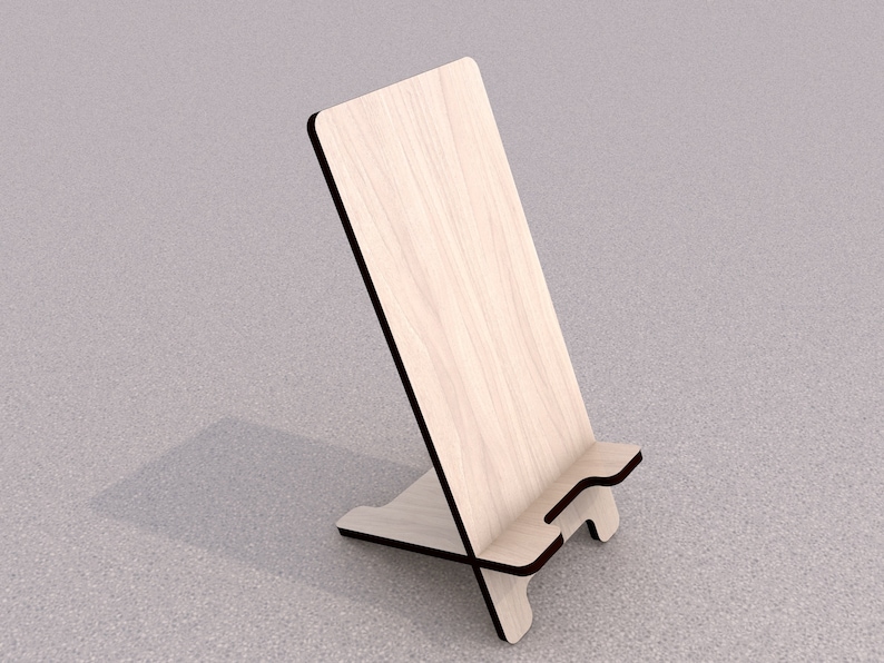 May include: A wooden phone stand with a light brown finish. The stand has a simple design with a raised platform for holding a phone.