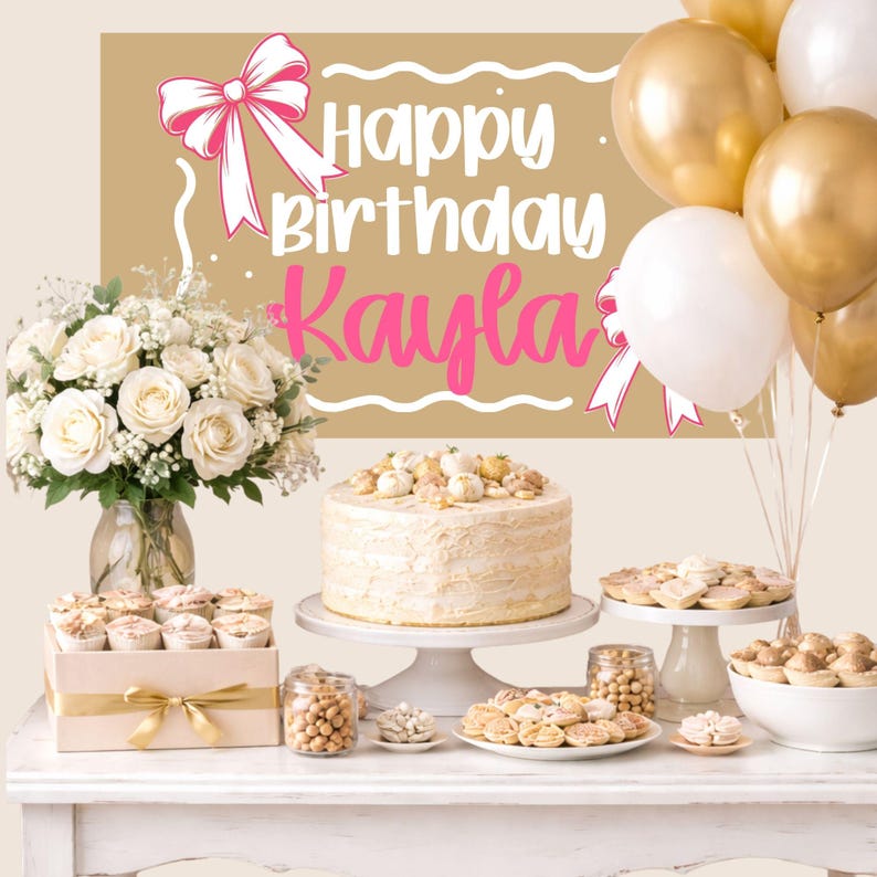 May include: A birthday celebration featuring a cake, cupcakes, cookies, and balloons. A banner displays "Happy Birthday Kayla" in pink. A bouquet of white roses and various treats are arranged on a white table, creating a festive atmosphere.
