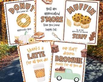 May include: Five printable cards with autumn-themed food puns. The cards feature a donut, s'more, muffin, latte, and brownie. Each card has an autumn-themed background and a cute illustration of the food.