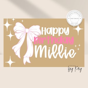 May include: A tan birthday card featuring a large pink bow and the words "Happy Birthday Millie" in white and pink. The card also has starburst graphics and the text "by Kay".