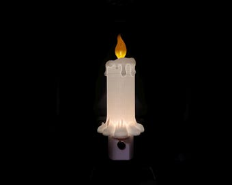 Acogedora vela derretida de noche, decoración navideña y del hogar