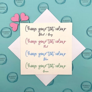 May include: A white card with the text "Choose your text colour" in black, followed by four options: "Black/Grey", "Pink", "Blue", and "Green". Each option is written in the corresponding colour.