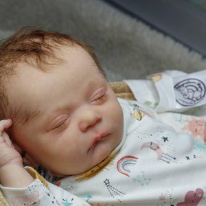 Newborn size reborn doll Pearl asleep. Realistic reborn baby. High end sleeping reborn baby . Ready for ship from USA.  Real photo.