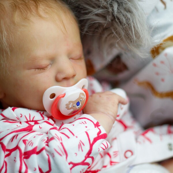 Reborn doll Alexa Asleep from professional reborn artist. Newborn size. Realistic reborn baby with rooted hair.  Ready to ship