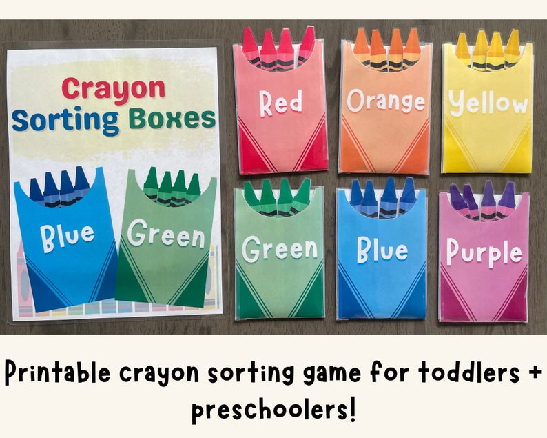 May include: Printable crayon sorting game for toddlers and preschoolers. The game features colorful boxes with the words "Red", "Orange", "Yellow", "Blue", "Green", and "Purple" printed on them. Each box has a picture of crayons inside.