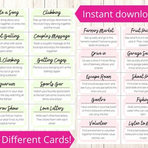 May include: A set of 100 pink and green cards with different date ideas for couples. The cards are arranged in a grid with each card having a different activity suggestion. The text on the cards includes activities such as "Write a Song", "Paint Balling", "Rock Climbing", "Aquarium", "Improv Show", "Clubbing", "Couple's Massage", "Batting Cages", "Sports Bar", "Love Letters", "Farmers Market", "Drive in", "Escape Room", "Bonfire", "Volunteer", "Fruit Picking", "Garage Sale-ing", "Shoot Pool", "Fishing", and "Listen to Music".