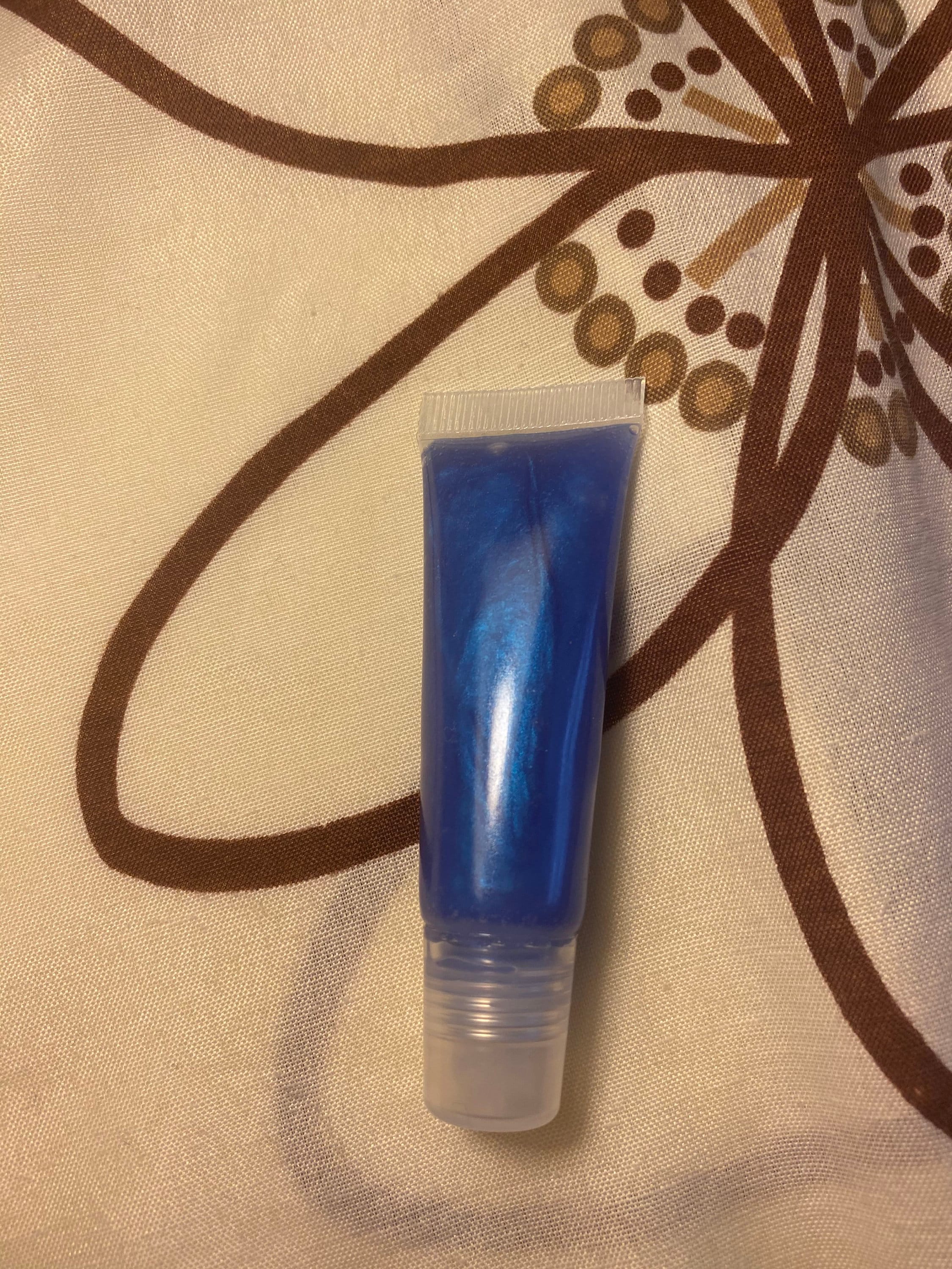 Bright Dark Blue Lip Gloss With Very Strong Pigment. Smells Just