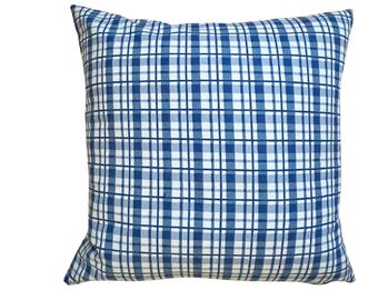 May include: A blue and white plaid throw pillow with a square pattern.