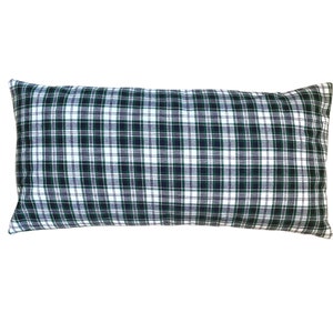 May include: A rectangular pillow with a green, white, and black plaid pattern.