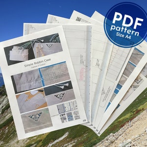 May include: A set of PDF patterns for a simple bobbin case, with instructions and diagrams. The patterns are printed on white paper and are labelled "PDF pattern Size A4".