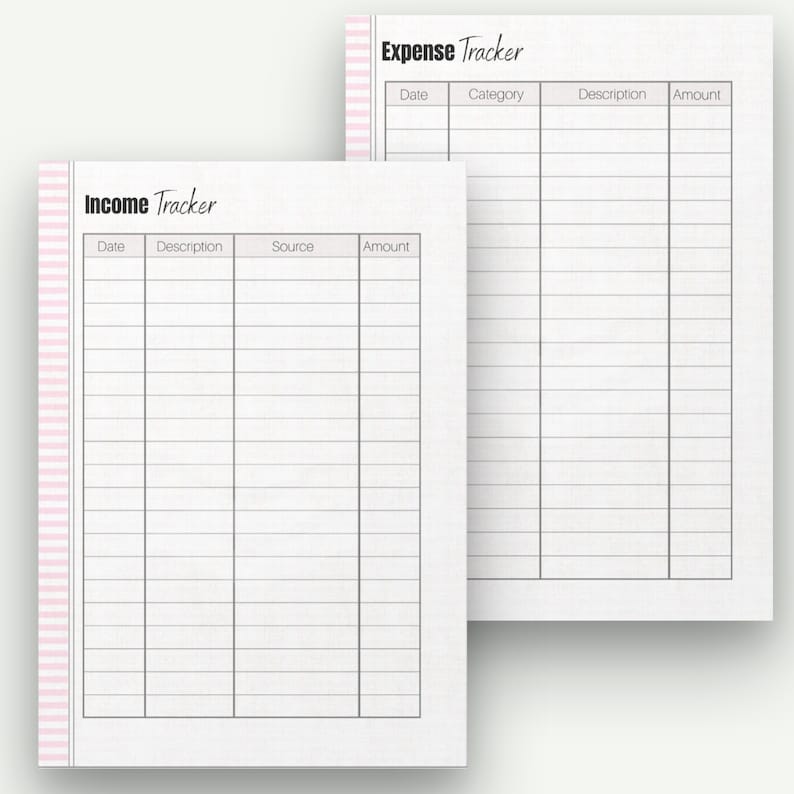 May include: Two white paper sheets with the titles "Income Tracker" and "Expense Tracker" in black script. Each sheet has a grid of lines for recording financial information. A pink and white striped border accents the left side of the "Income Tracker" sheet.