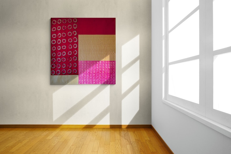 May include: Abstract art painting with geometric shapes in shades of pink, red, and gold. The painting features a pattern of white circles on a red background.