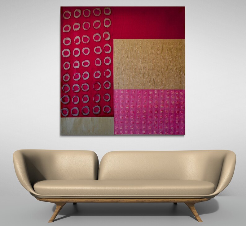 May include: Abstract art painting with a geometric design. The painting features a red background with a gold and pink pattern.