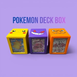 May include: Three colorful Pokemon deck boxes. The yellow box features Pikachu, the purple box has Gengar, and the orange box has Charizard. Each box has a character face on top and a card visible in the front. The text "Pokemon Deck Box" is at the top.