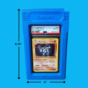 May include: A blue plastic Card Boy case holding a graded Pok&eacute;mon card. The card is a Machamp Holo from the 2016 XY Evolutions set. The case measures 6.75 inches tall and 4 inches wide.