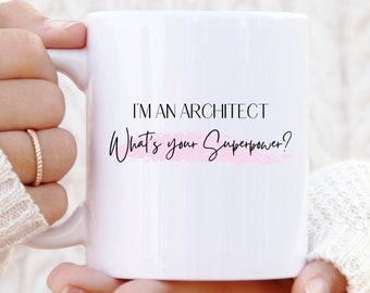 May include: White ceramic mug with black text that reads "I'm an Architect What's your Superpower?" with a pink watercolor stripe under the text.