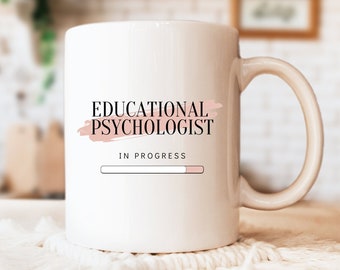 May include: White ceramic mug with a black and pink design that says "Educational Psychologist" and "In Progress" with a progress bar.