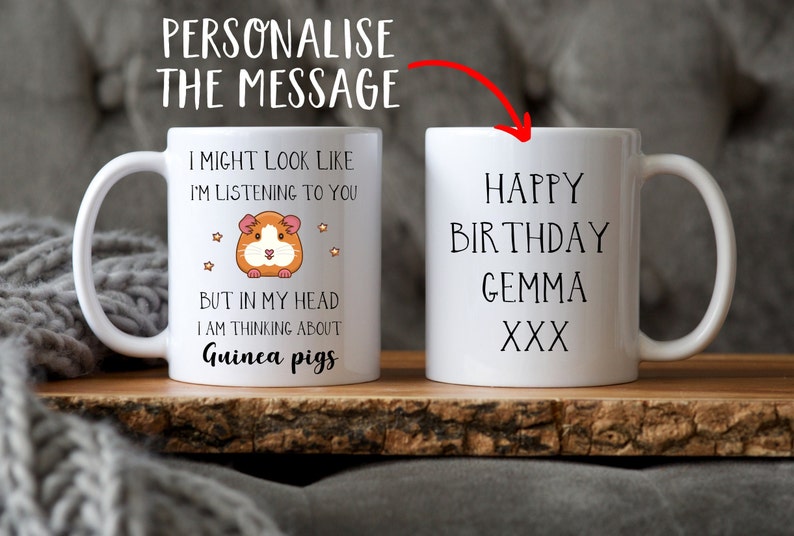 May include: White ceramic mug with a black handle. The mug features a cartoon guinea pig and the text "I might look like I'm listening to you, but in my head I am thinking about guinea pigs". The other side of the mug has the text "Happy Birthday Gemma XXX".