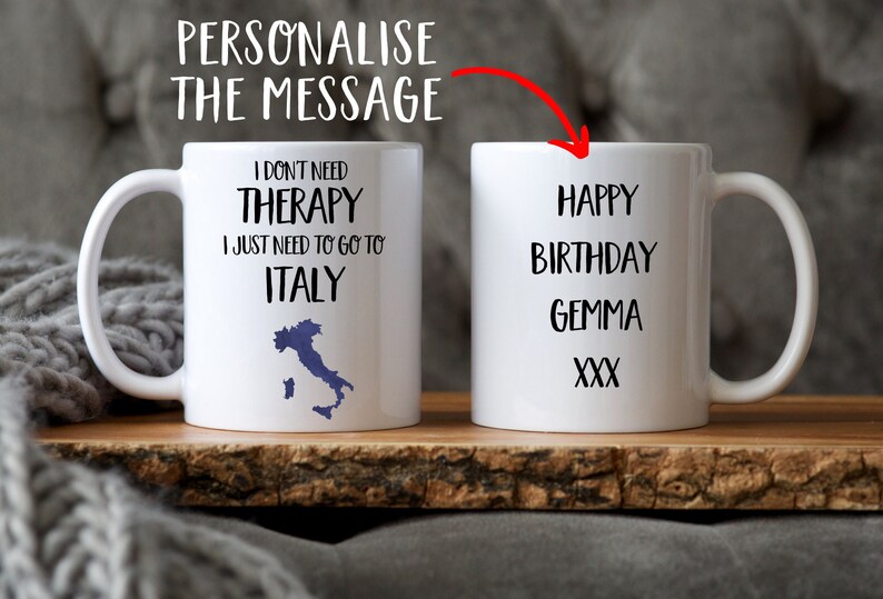 May include: Two white ceramic mugs. One mug has the text "I don't need therapy I just need to go to Italy" with a blue outline of Italy. The other mug has the text "Happy Birthday Gemma XXX".