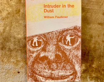 Intruder in the Dust by William Faulkner, a Vintage Penguin Paperback from 1964