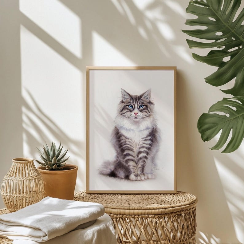 May include: A framed vertical art print featuring a detailed illustration of a fluffy grey and white tabby cat with striking blue eyes. The cat is depicted in a seated position, facing forward with a soft, realistic appearance against a light background.
