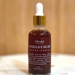 May include: A set of three ceramic mugs with a speckled, matte finish. The mugs are in shades of cream, light gray, and dark gray. Each mug has a simple, minimalist design and a rounded handle.