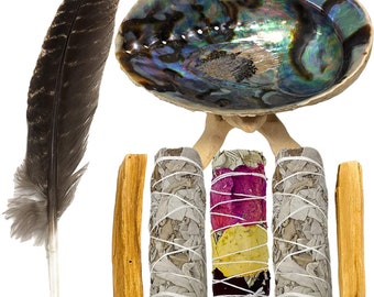 May include: A set of smudging tools including a white sage smudge stick, a palo santo stick, a rose petal smudge stick, and a feather. The smudge sticks are tied with twine and the feather is brown. The tools are arranged on a white background.