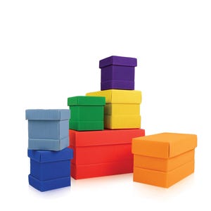 May include: A collection of colorful, corrugated cardboard boxes in various sizes and shapes. The boxes are stacked, with colors including blue, green, yellow, red, orange, and purple. The boxes are on a white background.