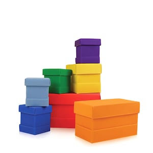 May include: A collection of colorful, rectangular gift boxes in various sizes. The boxes are stacked, showcasing a range of colors including blue, green, red, yellow, orange, and purple. The boxes have a textured, ribbed surface.