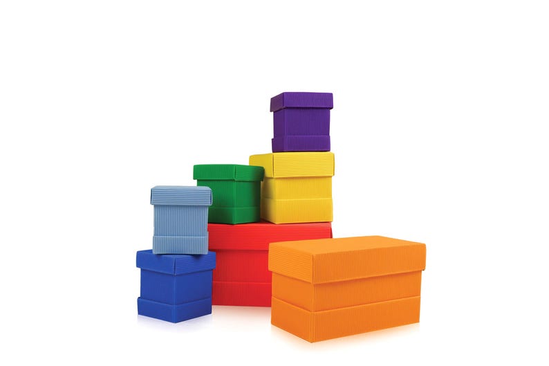 May include: A collection of colorful, rectangular gift boxes in various sizes. The boxes are stacked, showcasing a range of colors including blue, green, red, yellow, orange, and purple. The boxes have a textured, ribbed surface.
