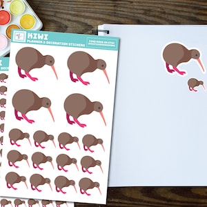 May include: A sheet of planner and decoration stickers featuring brown kiwi birds with pink legs. The stickers are arranged in rows and columns on a white background. The text "KIWI PLANNER & DECORATION STICKERS" is printed at the top of the sheet.