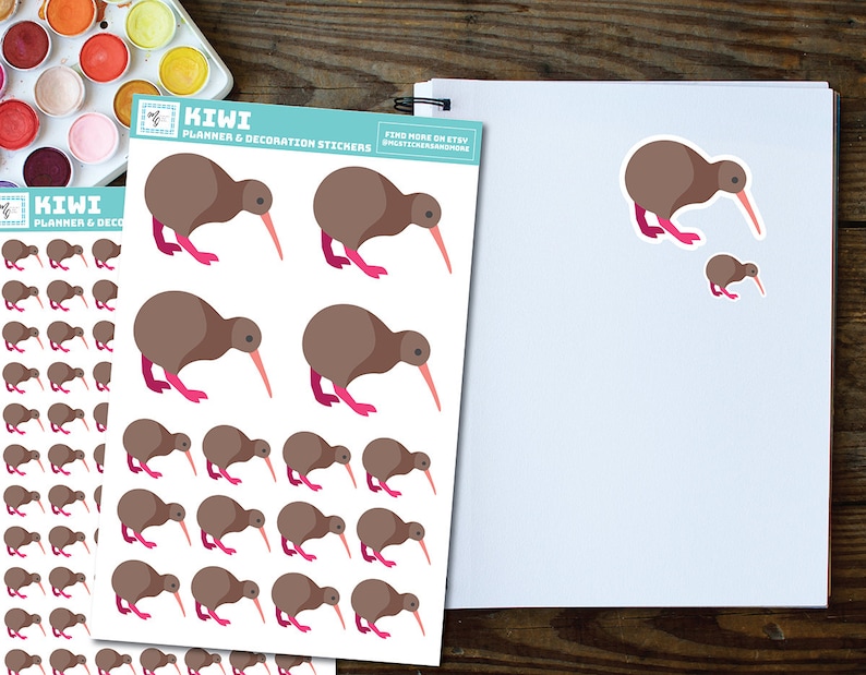 May include: A sheet of planner and decoration stickers featuring brown kiwi birds with pink legs. The stickers are arranged in rows and columns on a white background. The text "KIWI PLANNER & DECORATION STICKERS" is printed at the top of the sheet.