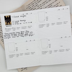 May include: A white paper book review log with black printed lines and text. The top left section is filled out with the title Crooked Kingdom, author Leigh Bardugo, 560 pages, and dates. It includes a quote about crows and checkboxes for genres.