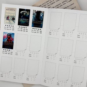 May include: A white reading log journal with printed templates for book covers, star ratings, and start and finish dates. Four book covers are filled in: Between Shades of Gray, Lady Midnight, Lord of Shadows, and Queen of Air and Darkness.