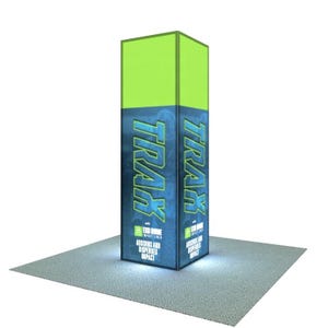 May include: A tall, rectangular display with the word "TRAK" in teal, outlined in light blue, repeated on two sides. The top section is bright green. The display sits on a light gray surface and has the text "ABSORBS AND DISPERSES IMPACT".