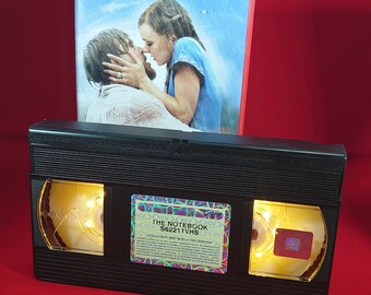 VHS nightlight of The Notebook in warm yellow