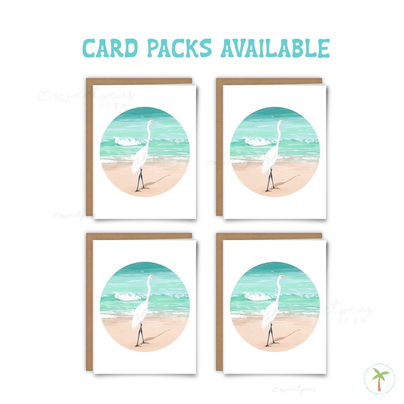 An A2 sized greeting card that features a spot illustration of a Great Egret on the beach near the shoreline, available a set