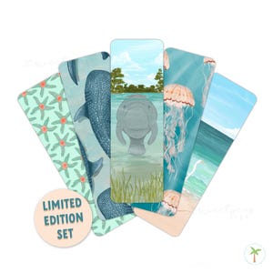 May include: A set of five rectangular bookmarks featuring marine illustrations including a pattern of green starfish, a blue whale shark, a manatee in water, pink jellyfish, and a coastal beach scene with a white bird. A circular label reads LIMITED EDITION SET.