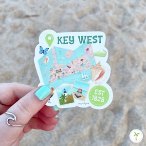 A Photo of a Key West Florida that includes an Illustration of a Key West Map; sea shells, lighthouse, Mile Marker 0, Key Lime Pie, The Southern Most Point and more!