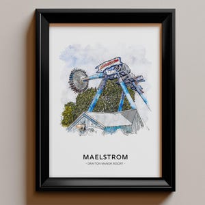 May include: A framed watercolour print depicting the Maelstrom amusement ride at Drayton Manor Resort. The artwork features a blue mechanical structure with a circular passenger carriage, green trees, and a building, with the text Maelstrom Drayton Manor Resort.